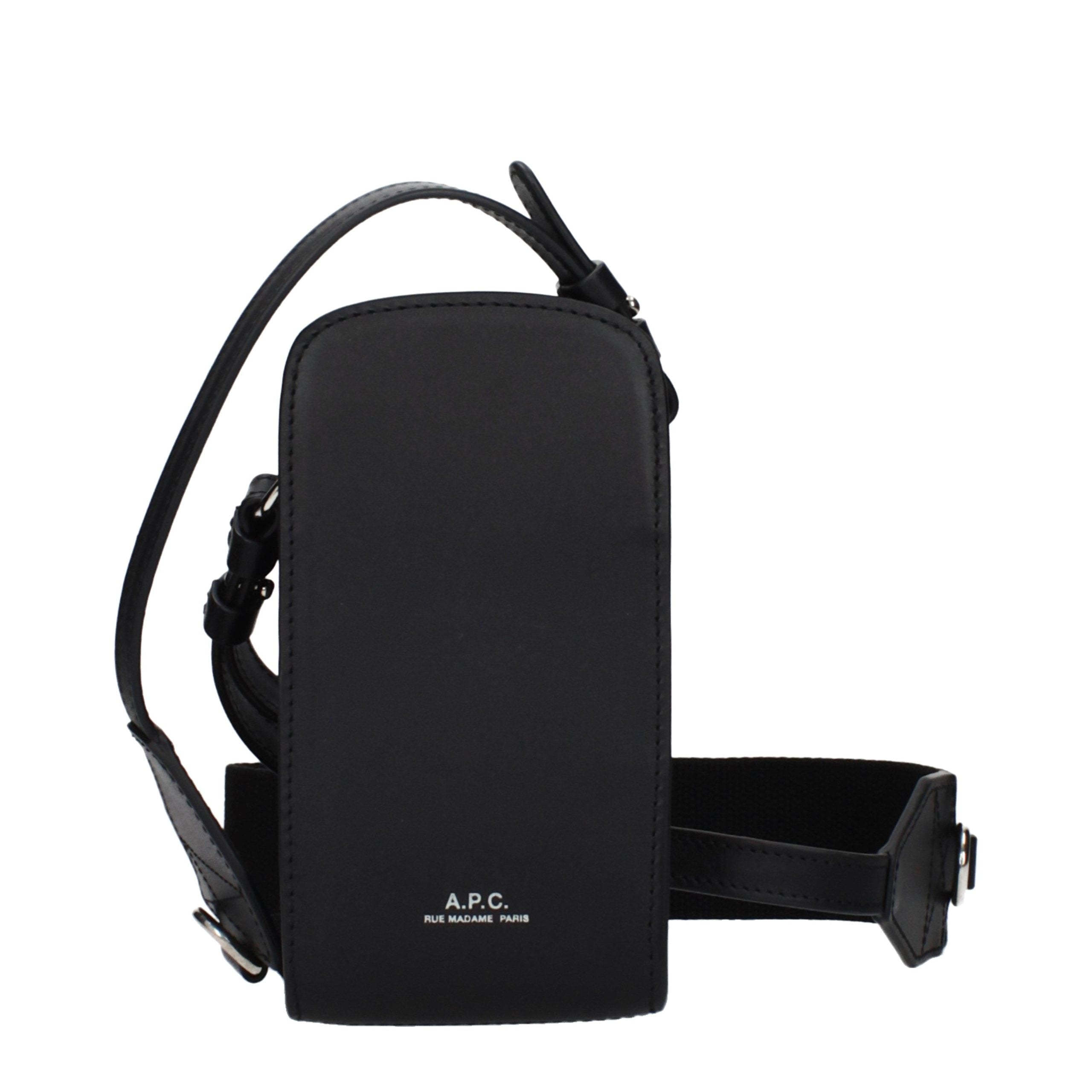 Front view of A.P.C. James black leather crossbody pouch with silver embossed logo and adjustable strap.