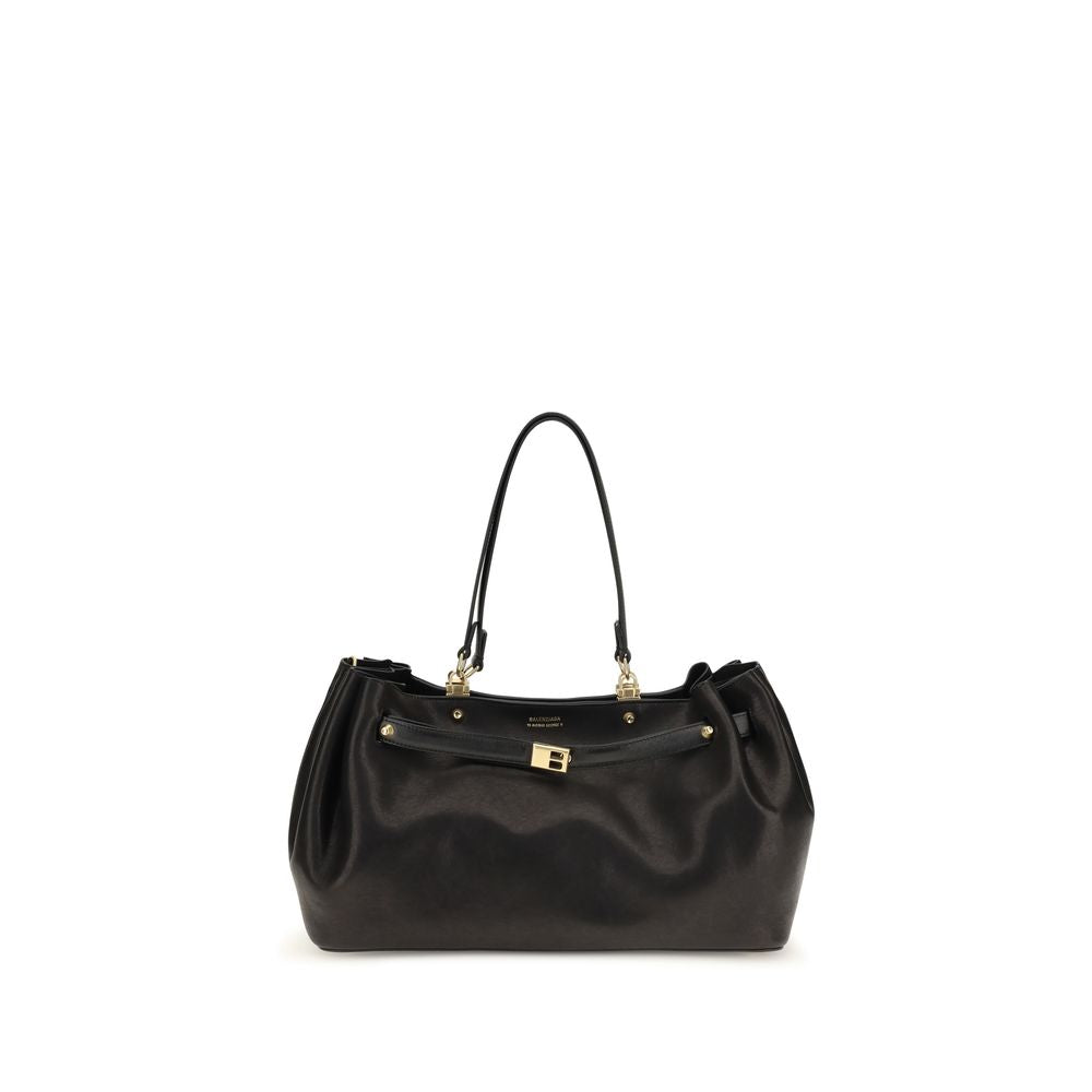 Balenciaga Fan Carry All Medium bag in black polished sheepskin with aged-gold hardware and lace closure system.
