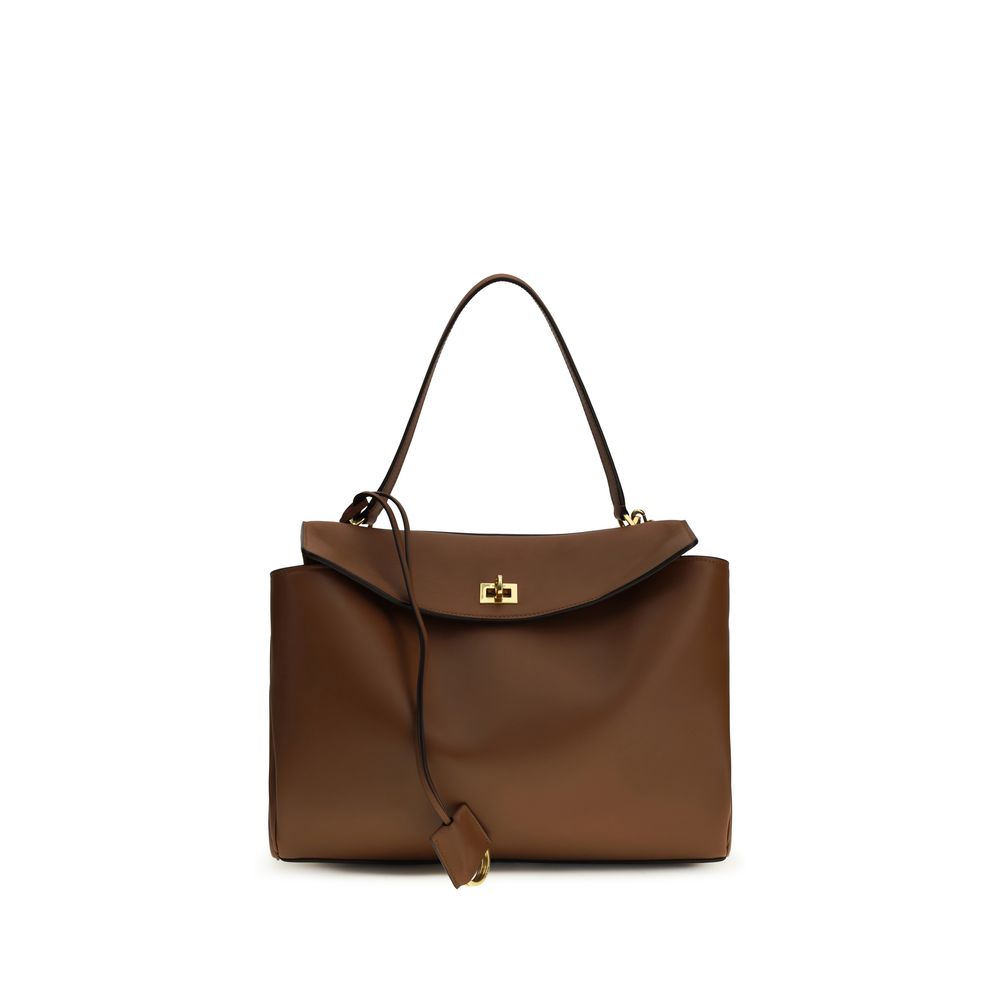 Balenciaga Rodeo Medium Handbag in New Tan smooth calfskin with aged-gold hardware from The Exclusive Line, Singapore.