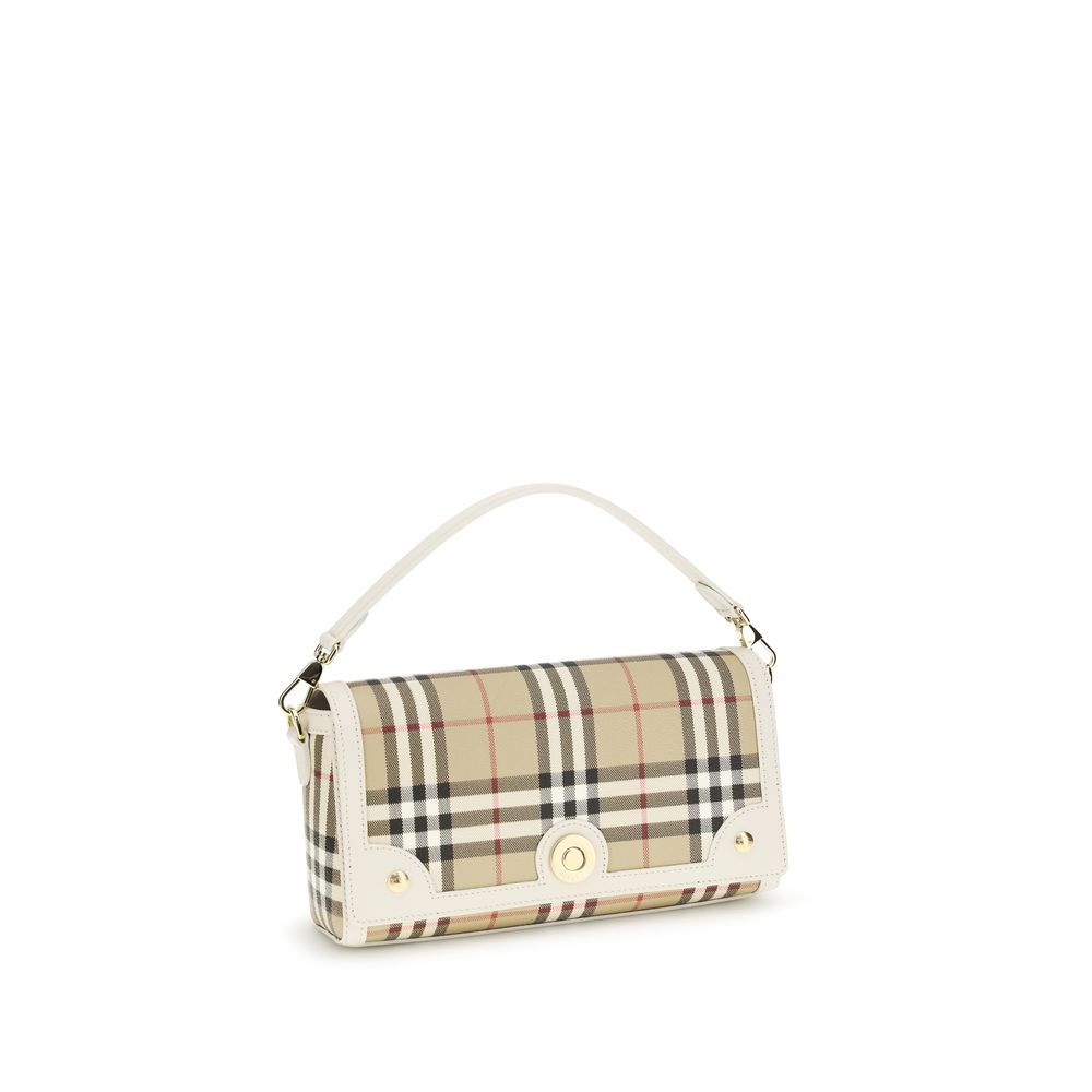 Side view of Burberry Top Handle Note Bag in Vintage Check and Beige leather trim from The Exclusive Line Singapore.
