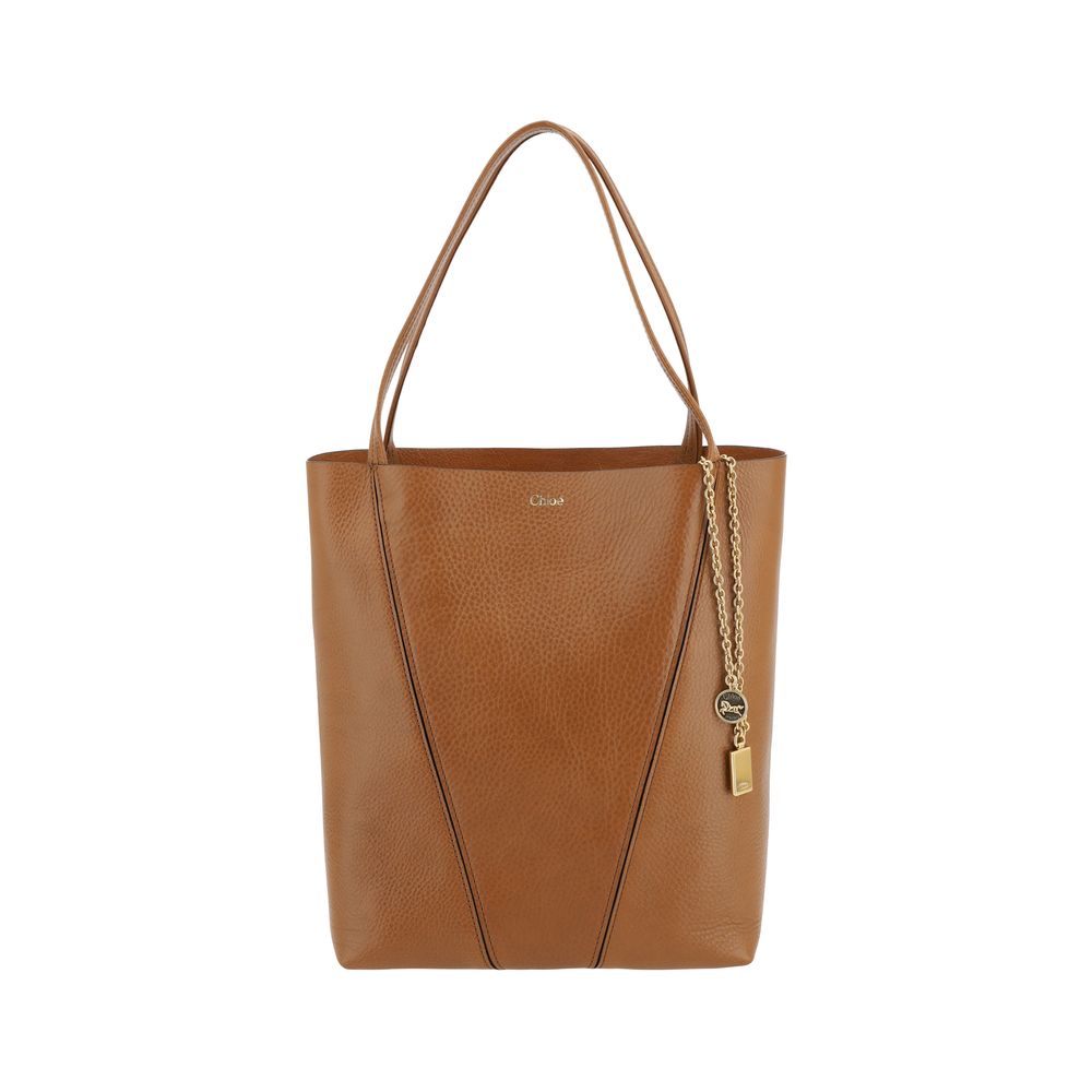 Chloé Spin Tote Bag in Grained Leather - Brown from The Exclusive Line Singapore.