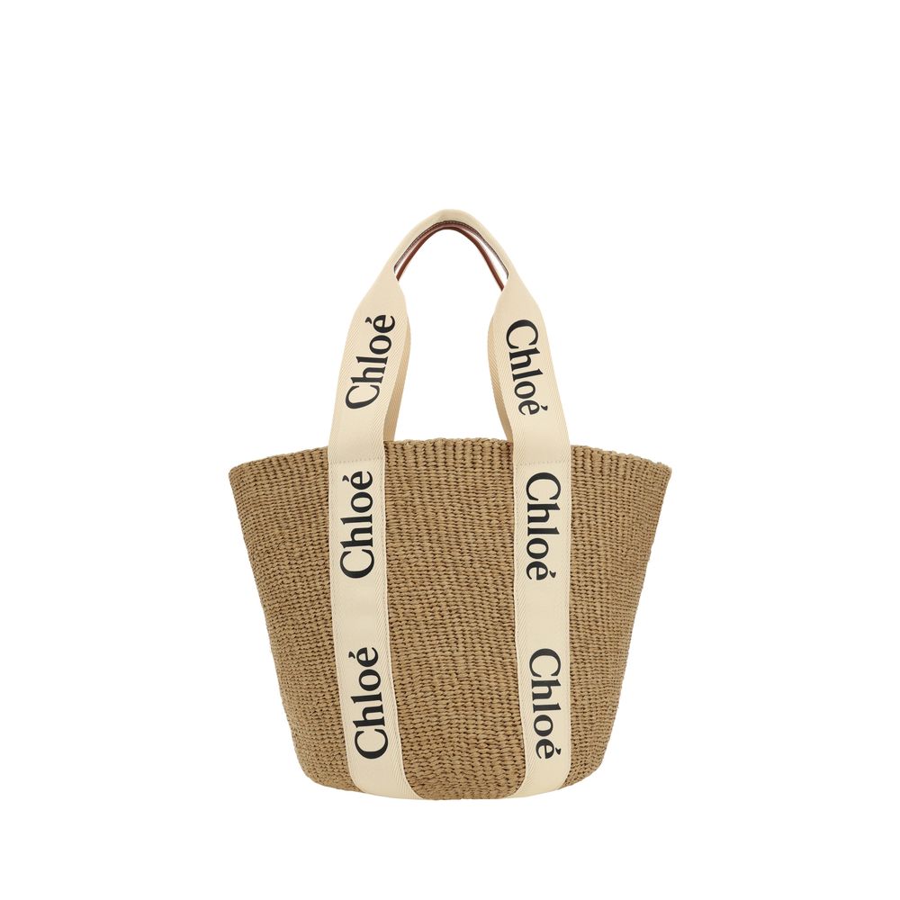 Chloé Large Woody basket bag in white and natural handwoven fiber with logo ribbon handles - The Exclusive Line Singapore.