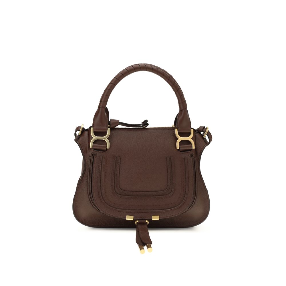 Chloé Marcie small handbag in crafty brown grained calfskin leather featuring hand-wrapped double handles, front flap with hanging tassels, and a removable strap from The Exclusive Line Singapore.