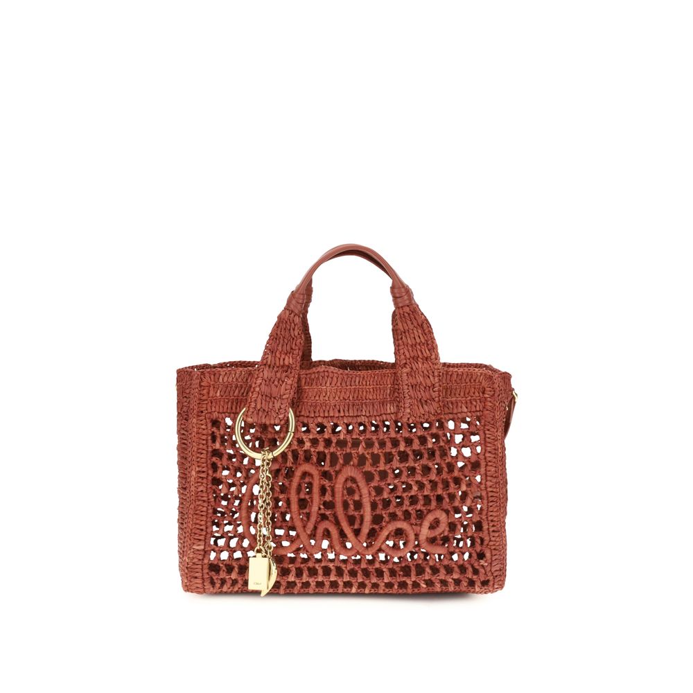 Chloé Small Summer Banana east-west tote bag in hand-crocheted ginger red raffia and buffalo leather trim with an artisan handwritten signature and dangling charms.