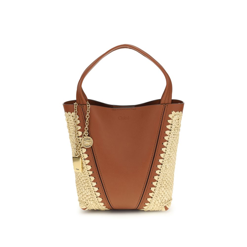 Chloé Spin Tote Bag Small in Clay Brown Raffia & Leather from The Exclusive Line Singapore.