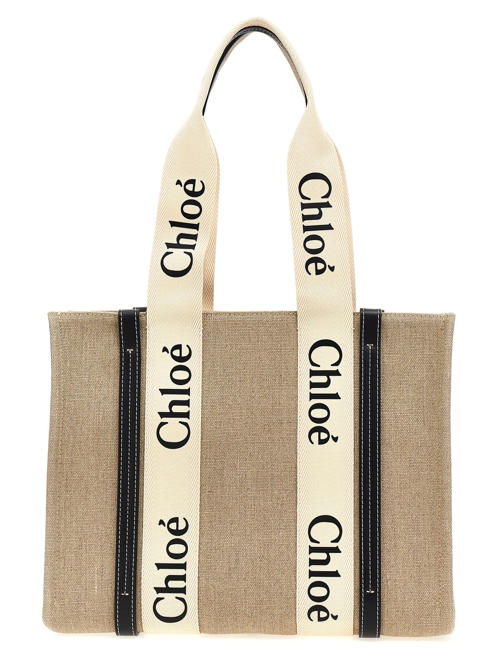 Chloé Woody medium tote bag in white linen canvas featuring blue shiny calfskin leather strips and the signature black-and-white logo ribbon from The Exclusive Line Singapore.