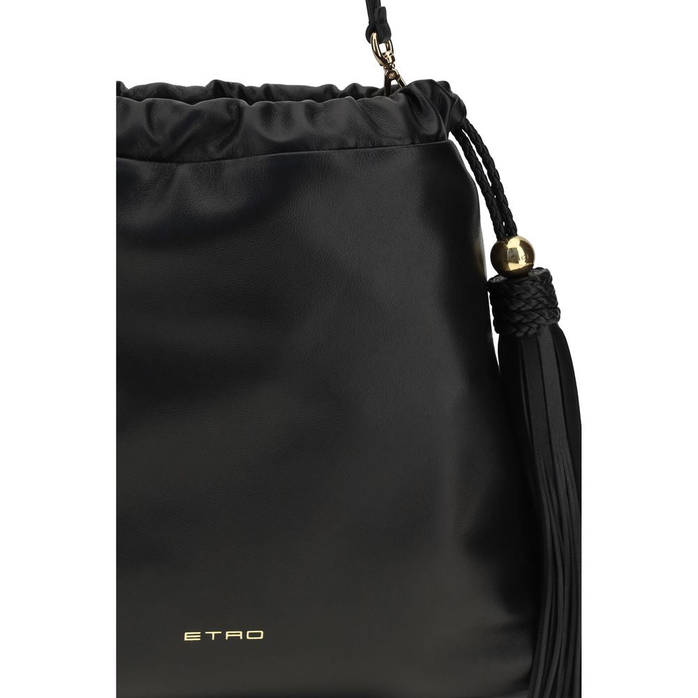 Close-up of the braided leather tassels and golden ETRO monogram charm on the black Kalispera bag.