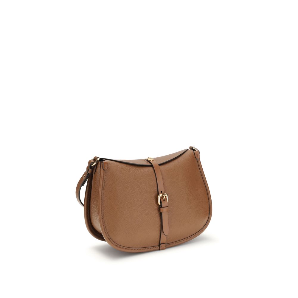 Side angle of Etro Medium Pony Bag in light brown tumbled leather with gold-finish Pegaso coin closure - The Exclusive Line Singapore.
