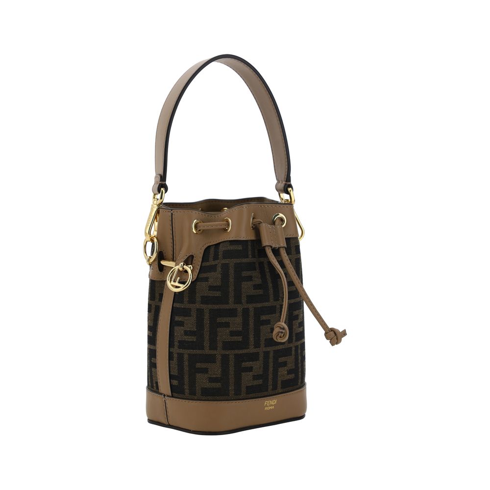 Side view of Fendi Mon Tresor Mini Bucket Bag in brown FF jacquard fabric with beige leather straps - The Exclusive Line Singapore