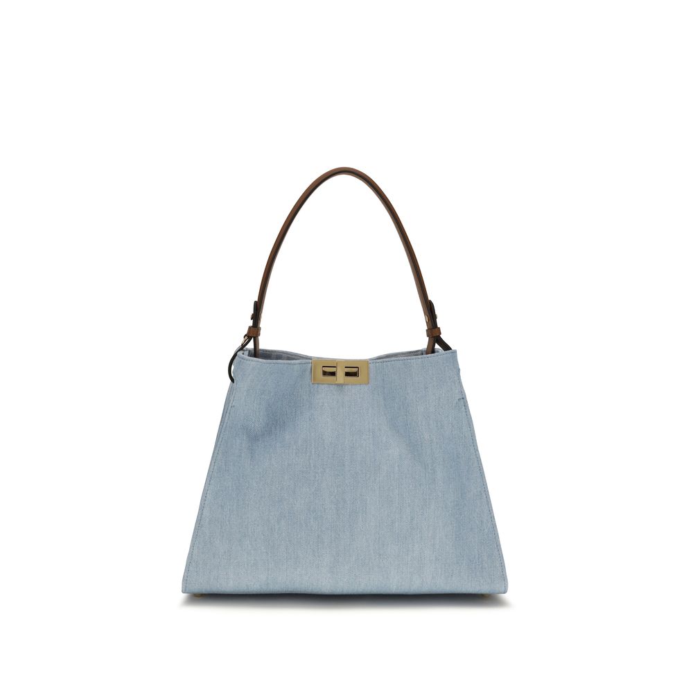 Fendi Way Medium bag in light blue organic cotton denim, featuring a soft tote silhouette, iconic gold twist lock, and adjustable shoulder handle.