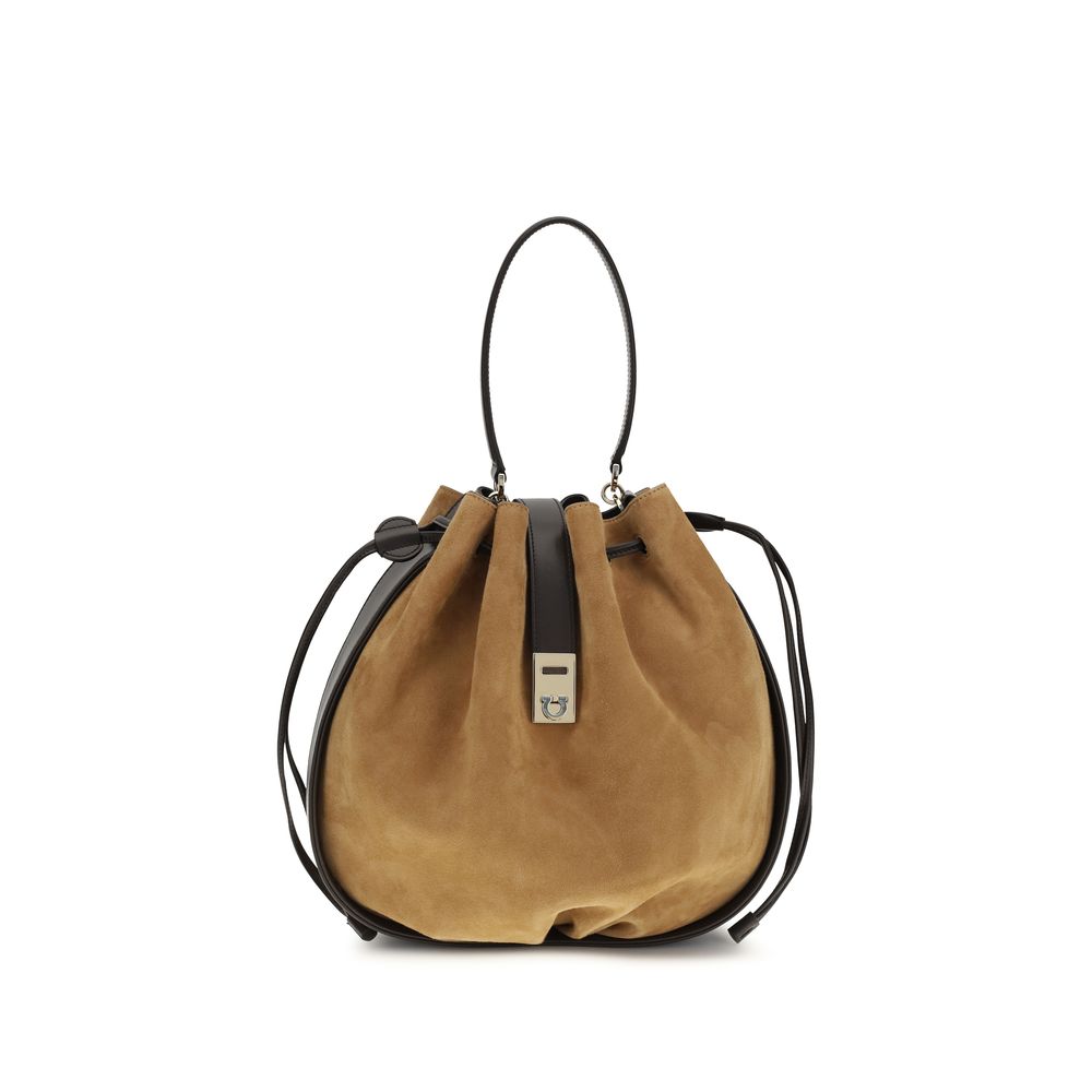Ferragamo Hug Buckle Bucket Bag in Natural Brown premium kid suede leather with a gold Hug buckle at The Exclusive Line Singapore.