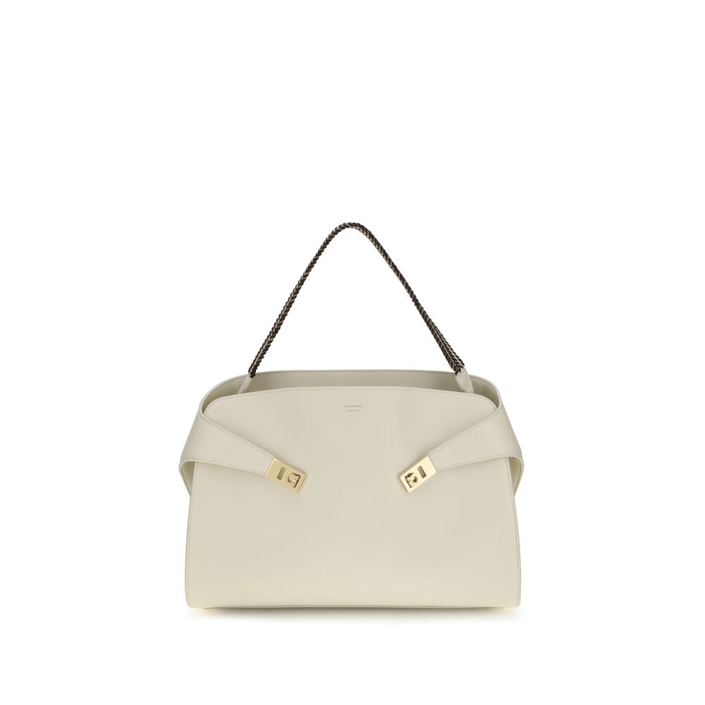 Ferragamo Hug Large Soft Shoulder Bag in Mascarpone cream nappa leather with Testa di Moro brown accents and woven top handle from The Exclusive Line Singapore.
