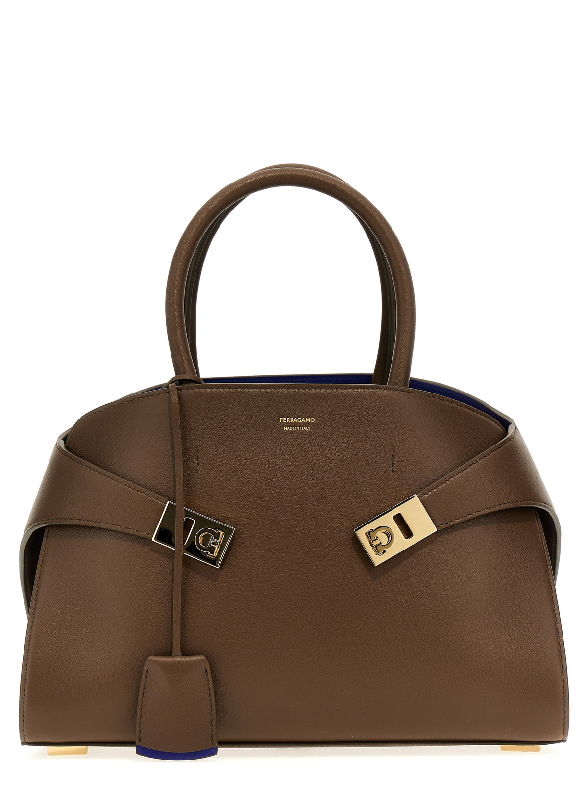 Ferragamo Hug Medium bicolor handbag in Clay and Lapis Lazuli natural-grain calfskin with gold Gancini buckles.
