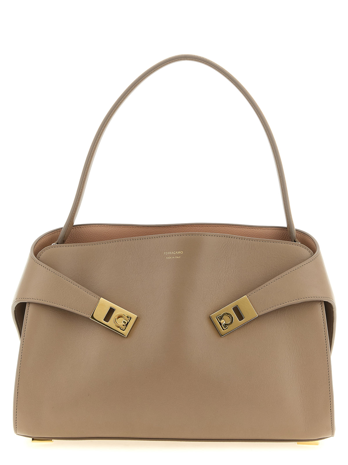 Ferragamo Hug Medium Soft shoulder bag in warm taupe and dusty pink calfskin with gold clasps.