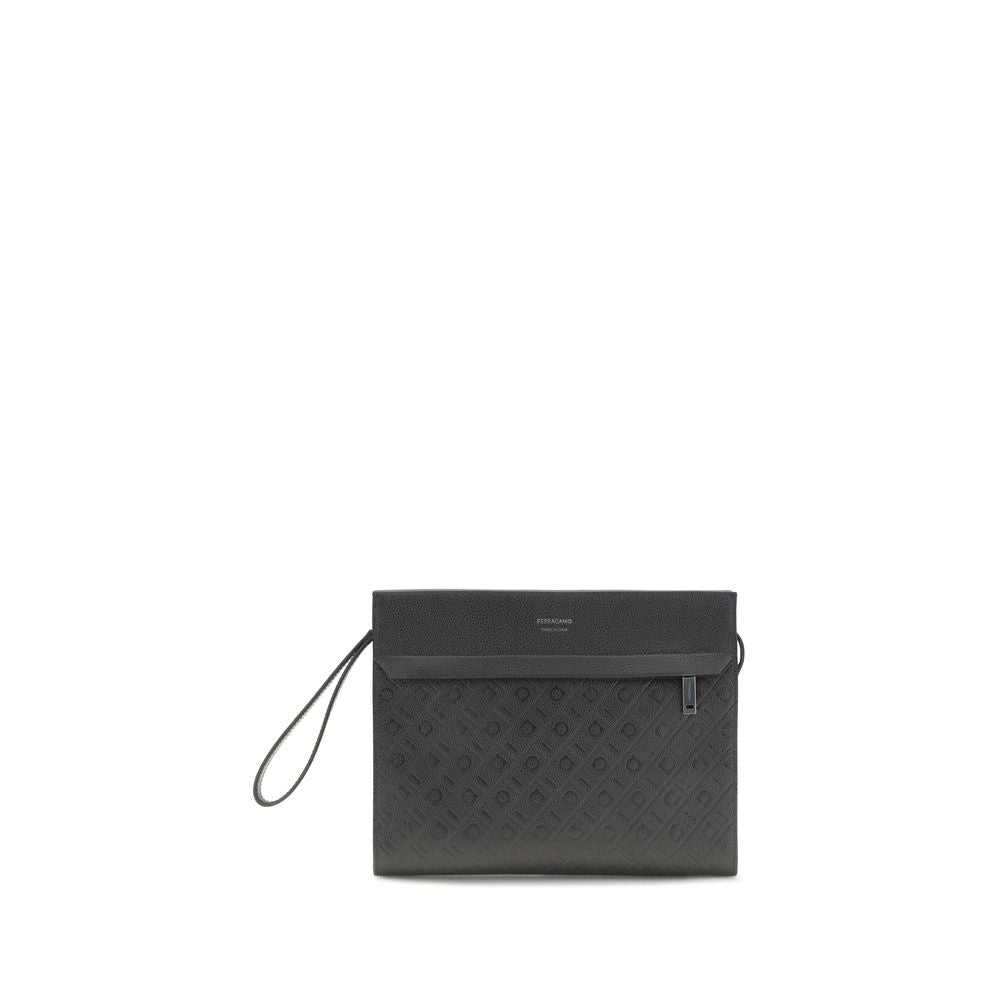 Ferragamo Monogram Pouch in black hammered calfskin leather featuring an embossed logo on the front and a zippered pocket with a wrist strap from The Exclusive Line Singapore.