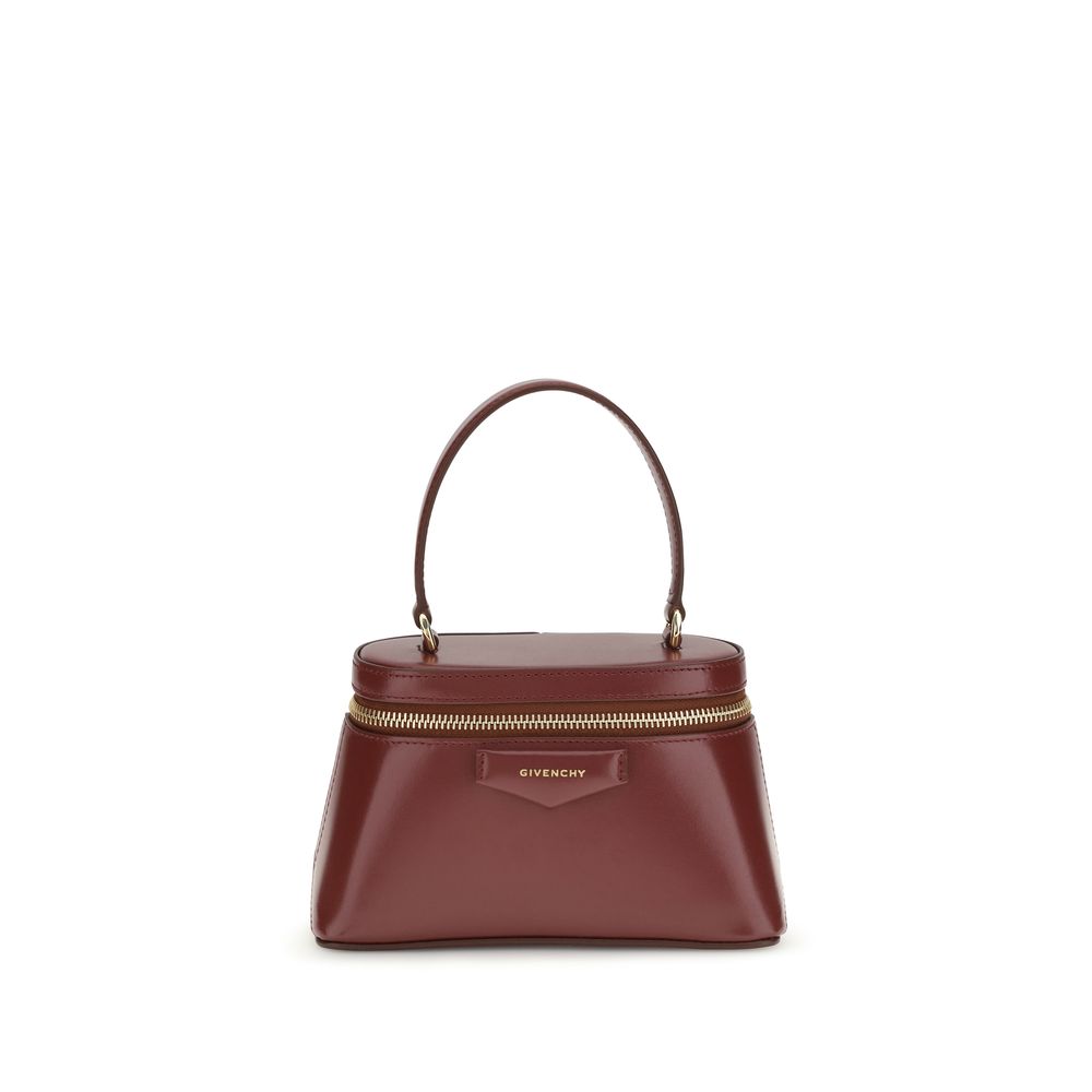 Givenchy Antigona Vanity Bag in Burgundy Box Leather with gold chain strap from The Exclusive Line Singapore.