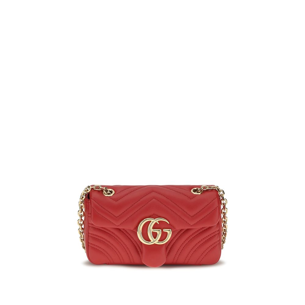 Gucci GG Marmont Small Shoulder Bag in bright red chevron matelassé nappa leather with gold-toned sliding chain strap and Double G hardware.