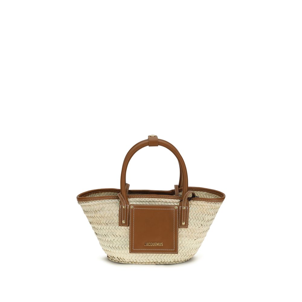 Jacquemus Le Petit Panier Soli mini handwoven palm basket bag with light brown leather trim and gold logo.