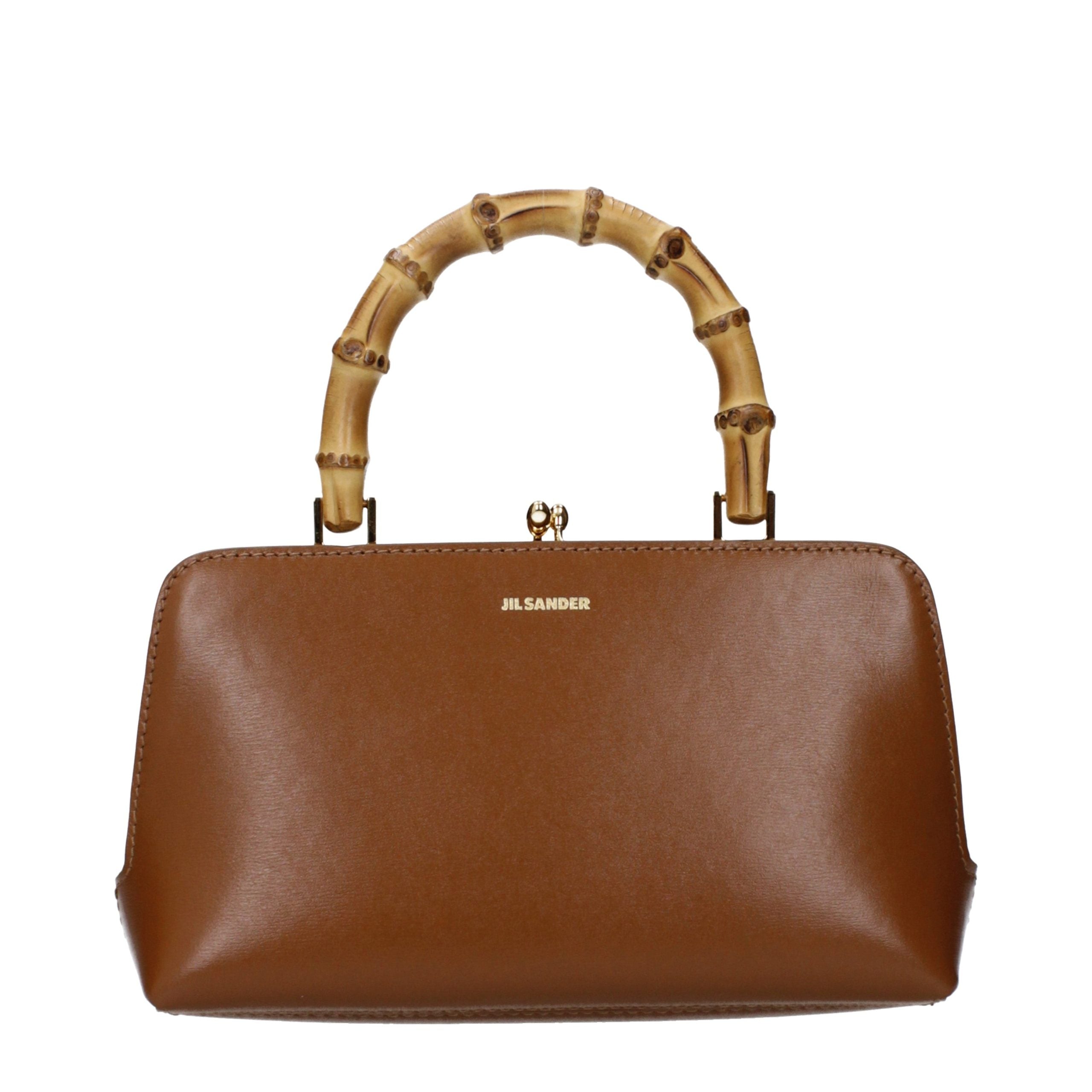 Jil Sander Goji Bamboo Mini bag in brown calf leather with natural bamboo handle and detachable strap.