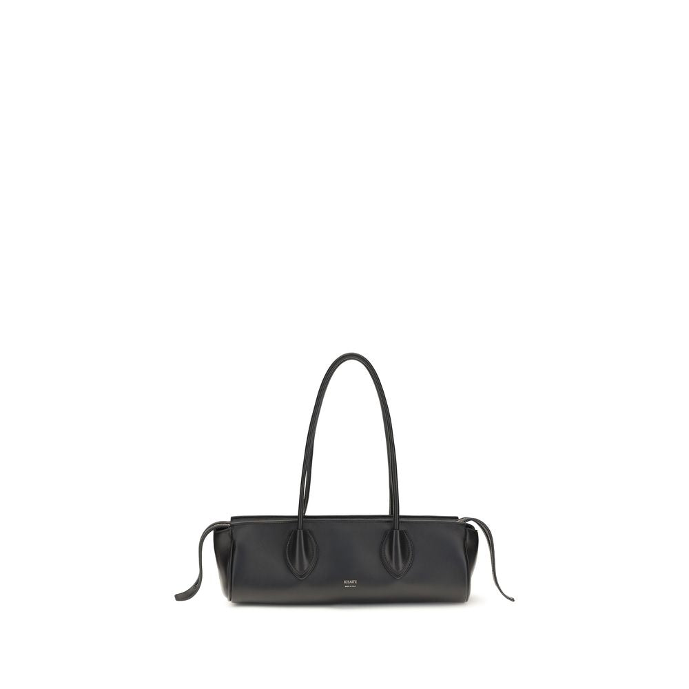 Khaite Donna Shoulder Bag in black nappa lambskin with brass Empire hardware and elongated east-west silhouette.