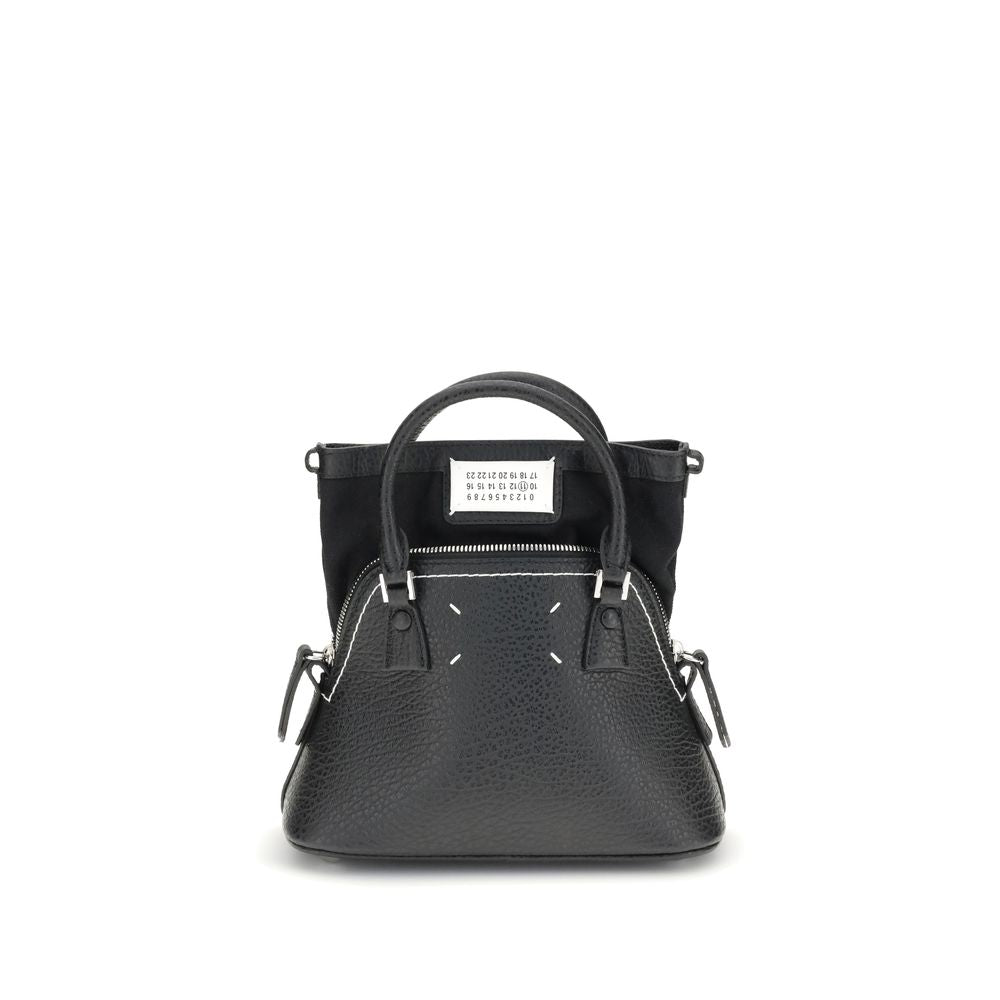 Maison Margiela 5AC Classique Micro Shoulder Bag in black grained leather featuring top handles, chain strap, and signature numeric logo patch.