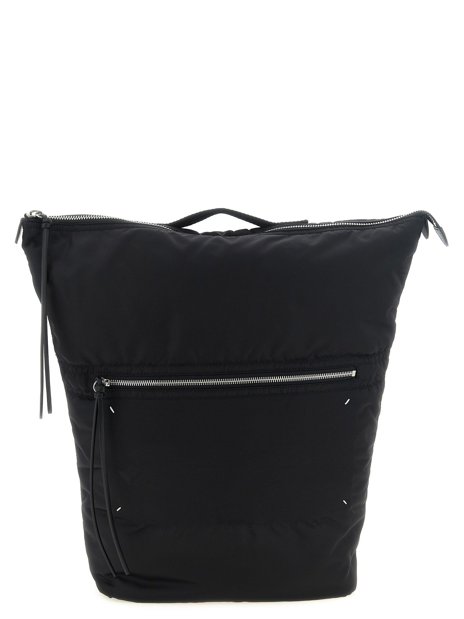 Maison Margiela Zip Backpack in black technical nylon featuring oversized dual-end zipper pulls, front zip pocket, and padded shoulder straps.