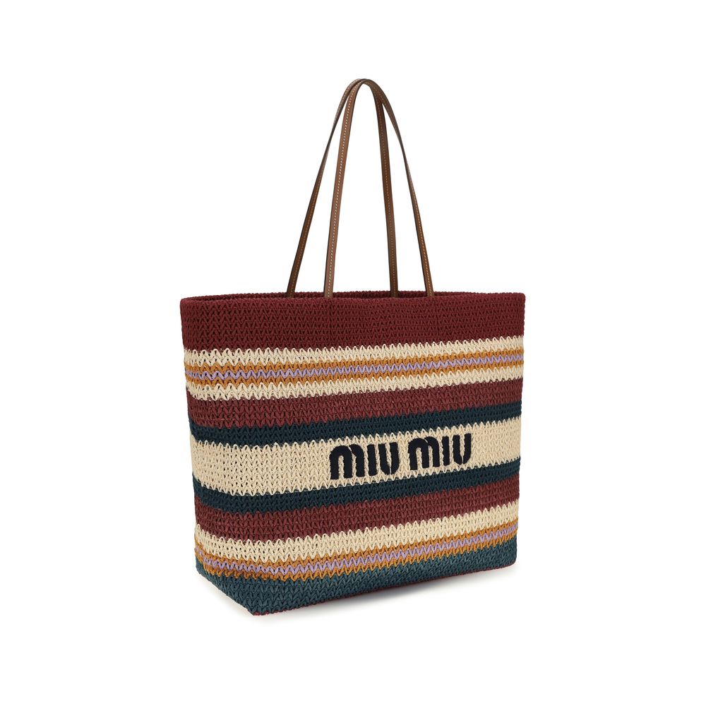 Side view of Miu Miu Raffia-effect woven tote bag in rust, green, and natural stripes with leather handles, available at The Exclusive Line Singapore.