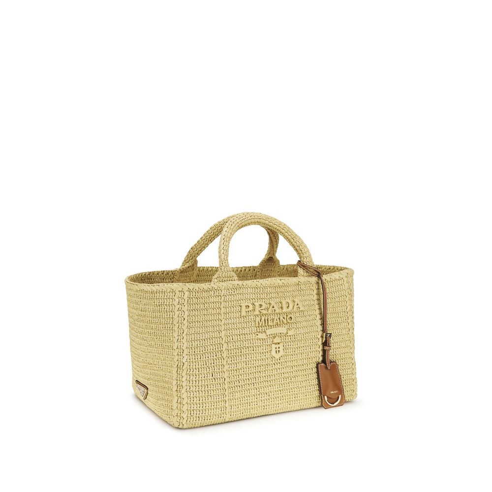Prada Large Crochet Tote Bag in Natural raffia-effect fabric with embroidered macro logo and side metal logo, available at The Exclusive Line Singapore.