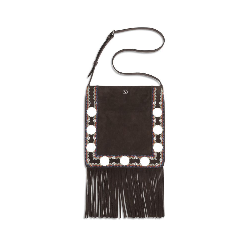 Valentino Garavani Nellcôte Shoulder Bag with Fringes in Brown Suede with palladium-finish ball studs from The Exclusive Line Singapore.