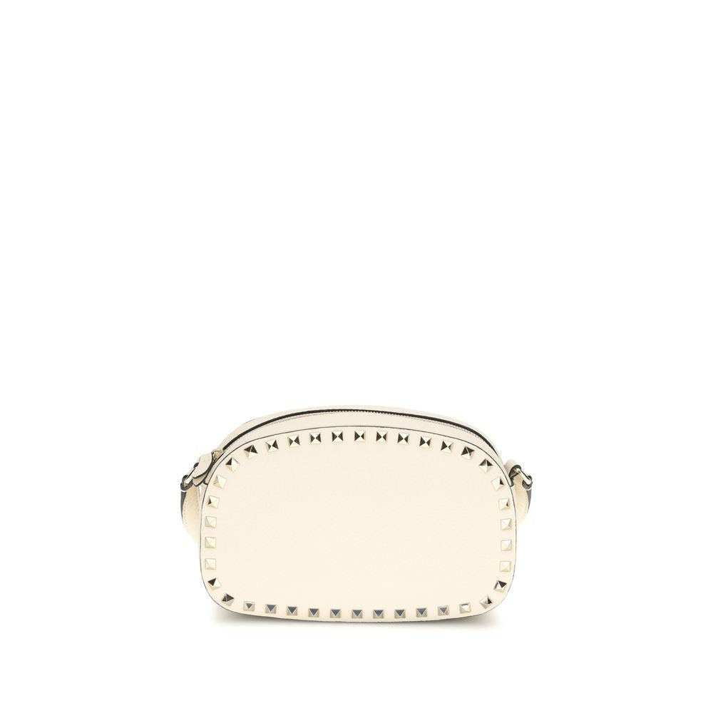Valentino Garavani Rockstud Mini Crossbody Bag in White Grainy Calfskin from The Exclusive Line Singapore.