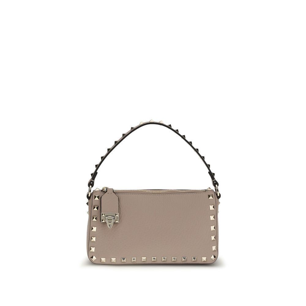 Valentino Garavani Small Rockstud Crossbody Bag in Grainy Leather with Hook Closure in Nude from The Exclusive Line Singapore.