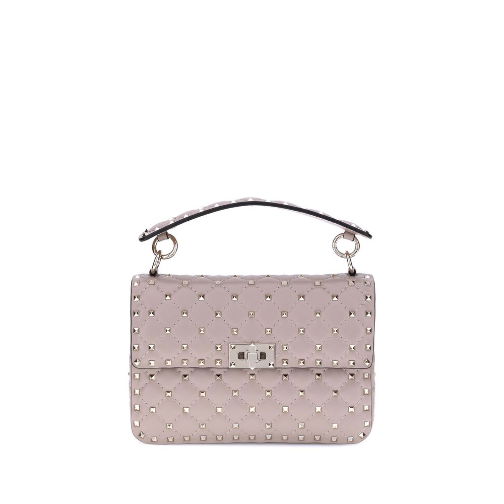 Light Pink quilted nappa leather Valentino Garavani Rockstud Spike medium handbag with platinum studs and chain strap from The Exclusive Line, Singapore.