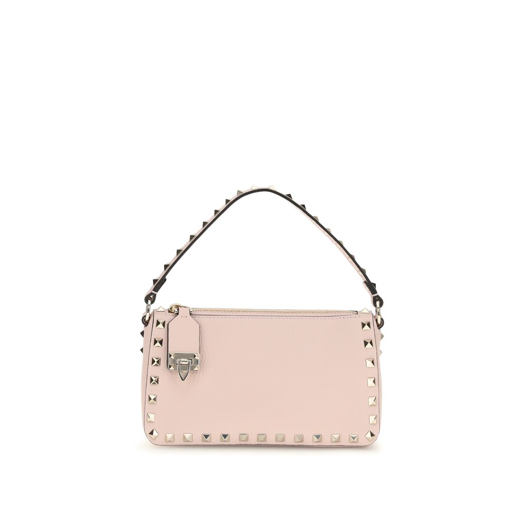 Valentino Garavani Rockstud small crossbody bag in pink grainy calfskin leather with platinum studs and hook closure.