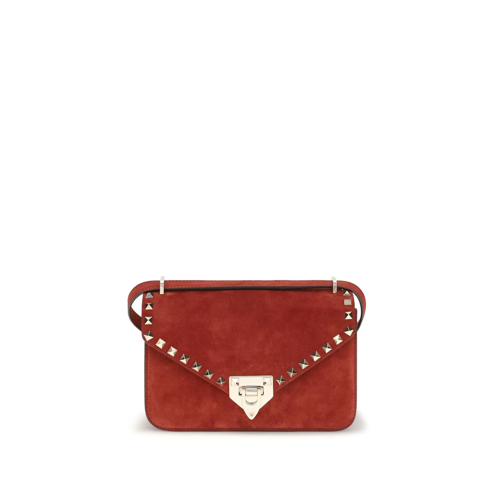Valentino Garavani Rockstud small crossbody bag in vibrant red suede with platinum-finish studs.
