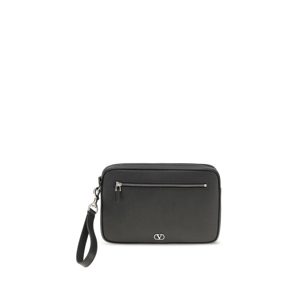 Valentino Garavani VLogo zip top clutch bag in black grained calf leather with silver-tone hardware and wrist strap.