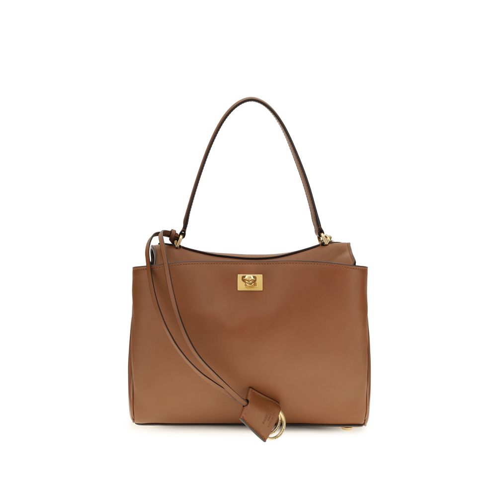 Balenciaga Rodeo Handbag Small in New Tan smooth calfskin leather featuring a relaxed open-flap design, structured top handle, and aged-gold turn-lock closure from The Exclusive Line.