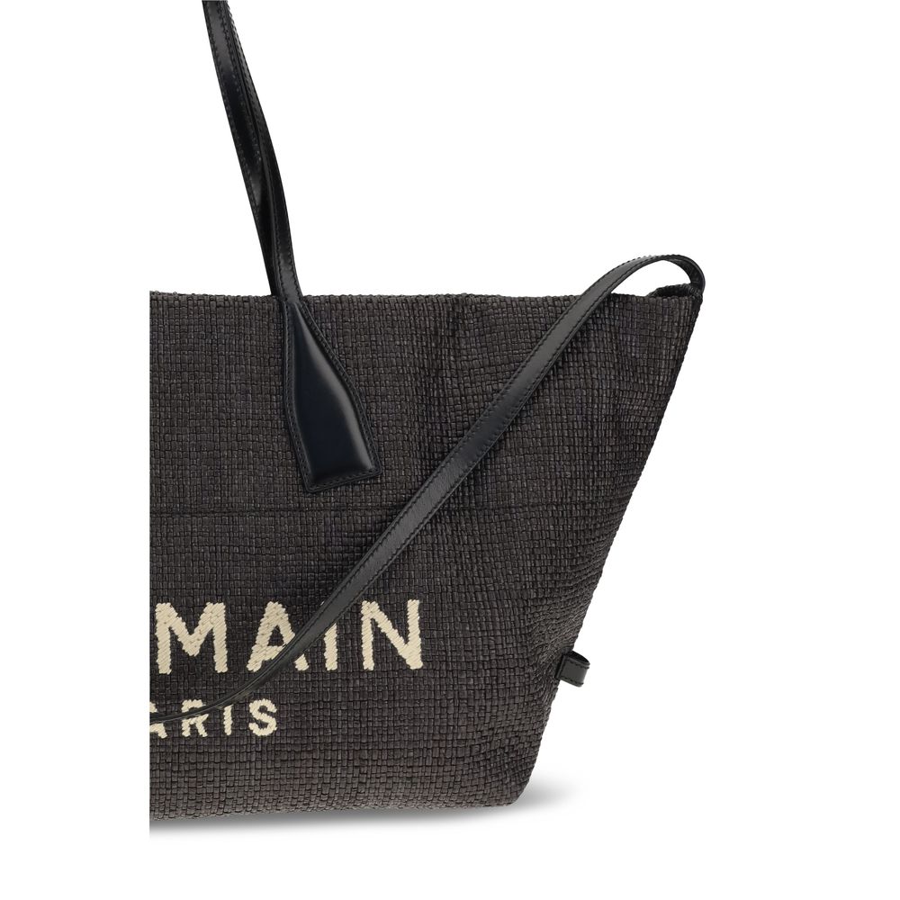Close up view of of Balmain Track Tote Bag in Black Raffia and Calfskin from The Exclusive Line Singapore.