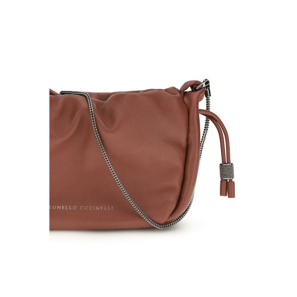 Close-up of the shimmering monili shoulder strap on Brunello Cucinelli Mellow Mini bag - The Exclusive Line