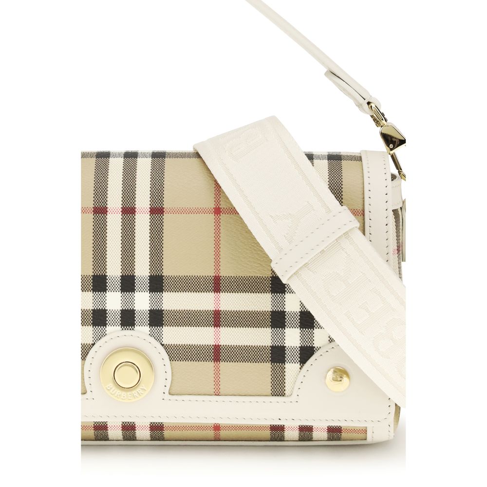 Close up of Burberry Top Handle Note Bag in Vintage Check and Beige leather trim from The Exclusive Line Singapore.