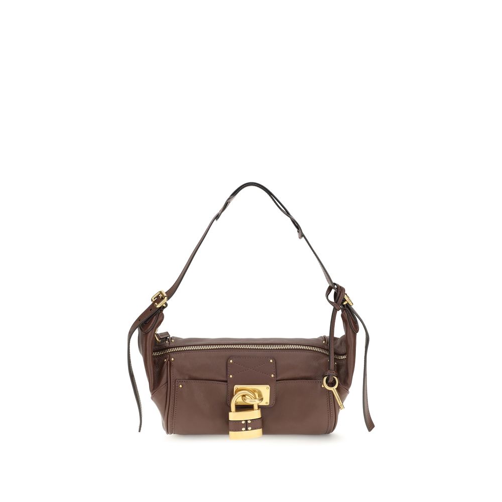 Chloé Paddington crossbody bag in rich brown calf leather featuring a contemporary silhouette, iconic oversized padlock, gold-tone studs, and C-shaped buckles.