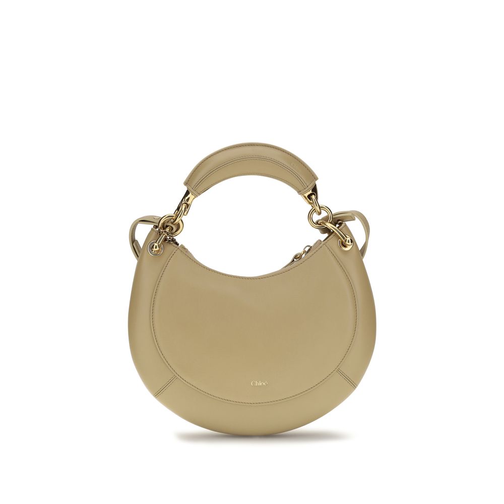 Chloé Banana small hobo bag in beige soft nappa lambskin leather featuring a crescent silhouette and streamlined top zip closure from The Exclusive Line Singapore.
