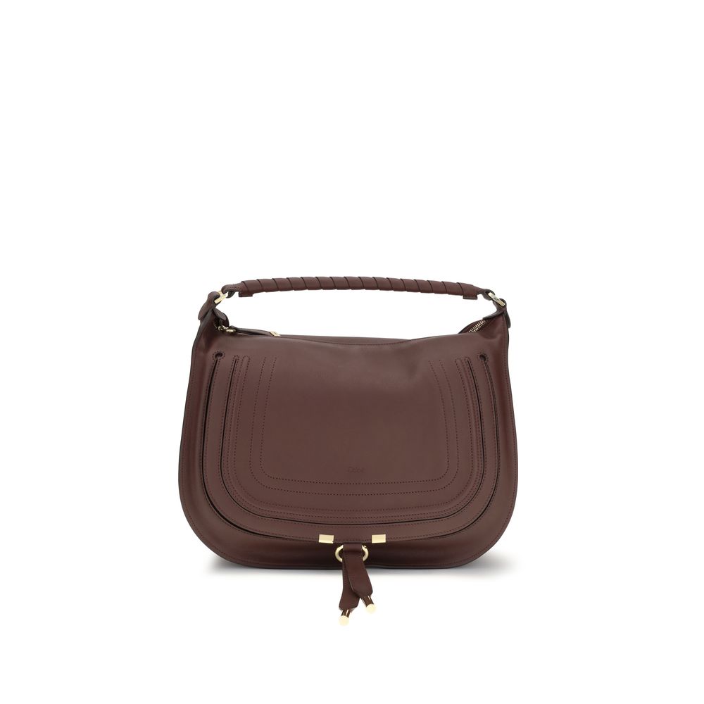 Chloé Marcie shoulder bag in dark velvet smooth calfskin leather featuring a slouchy silhouette, hand-wrapped single handle, and gold-tone hardware from The Exclusive Line Singapore.