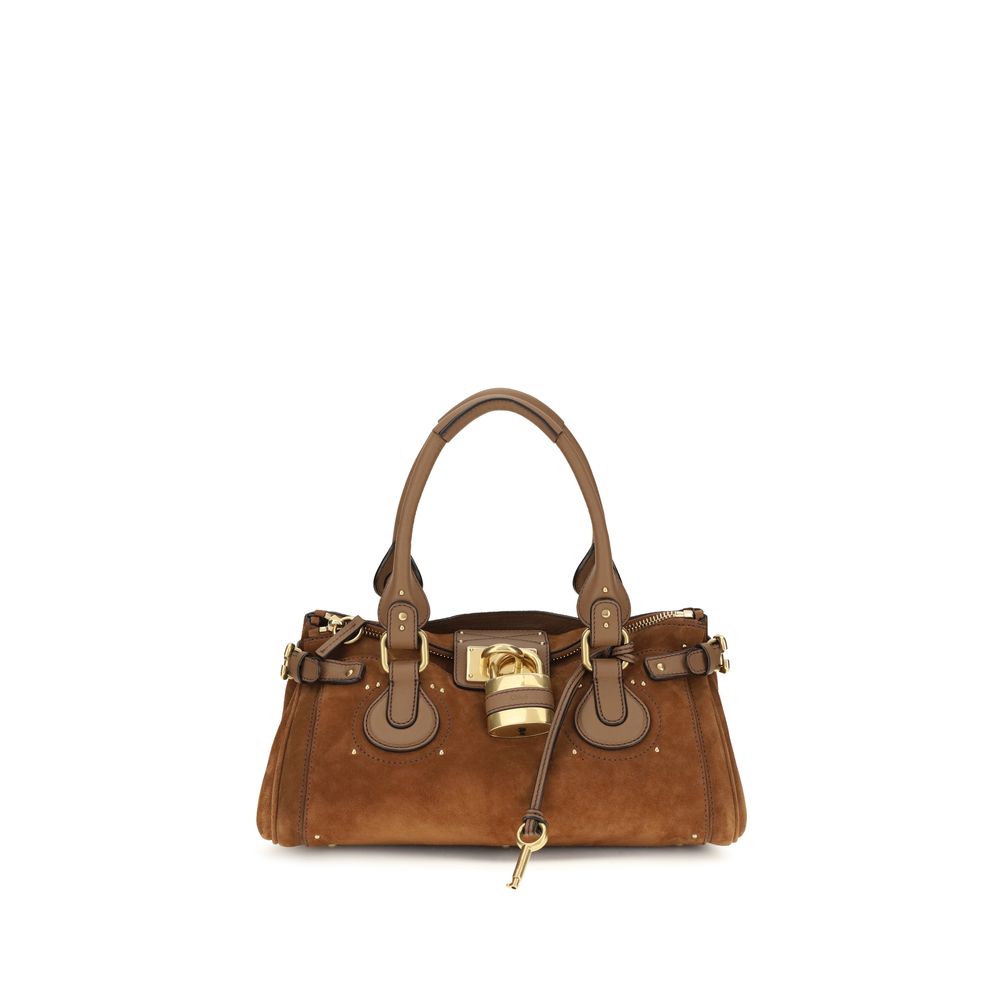 Chloé 20th Anniversary Paddington bag in vintage brown suede leather featuring a slouchy silhouette, signature oversized padlock, and C-shaped metal buckles.