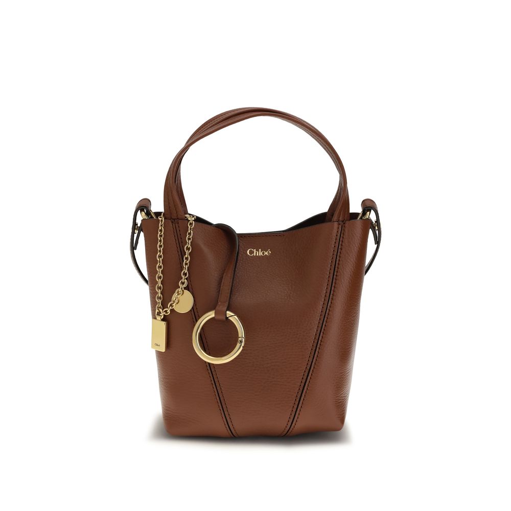Chloé Spin small tote bag in blushy brown shiny grained cowhide featuring graphic lines, dual handles, and a gold-tone chain with the signature Horse Medal from The Exclusive Line Singapore.