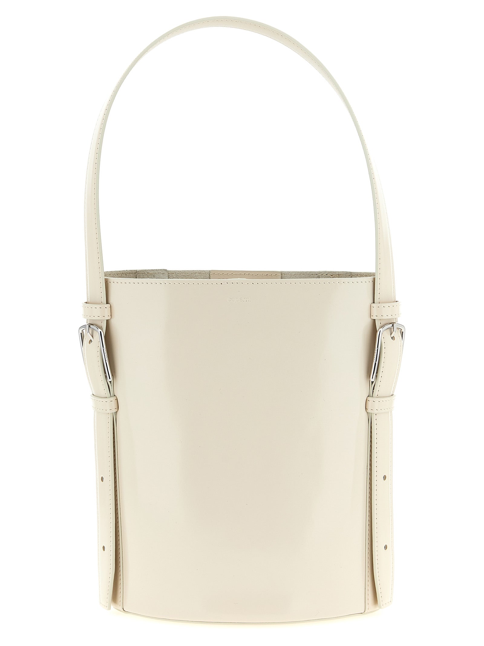 Coperni Ergonomic Bucket Bag in soft beige abrasivato leather, featuring a structured cylindrical form and curved top handle from The Exclusive Line Singapore.