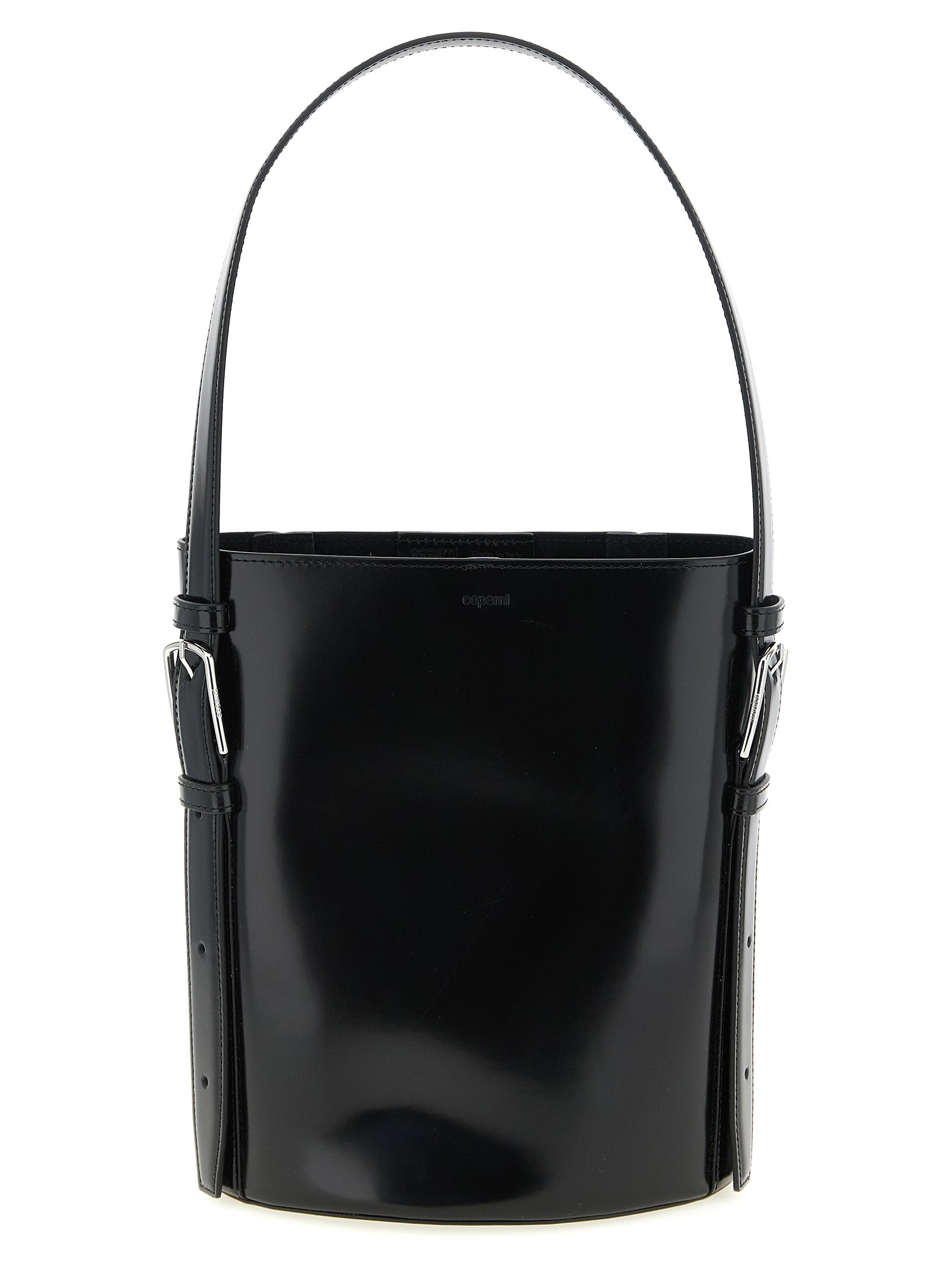 Coperni Ergonomic Bucket Bag in classic black abrasivato leather, featuring a structured cylindrical form and curved top handle from The Exclusive Line Singapore.