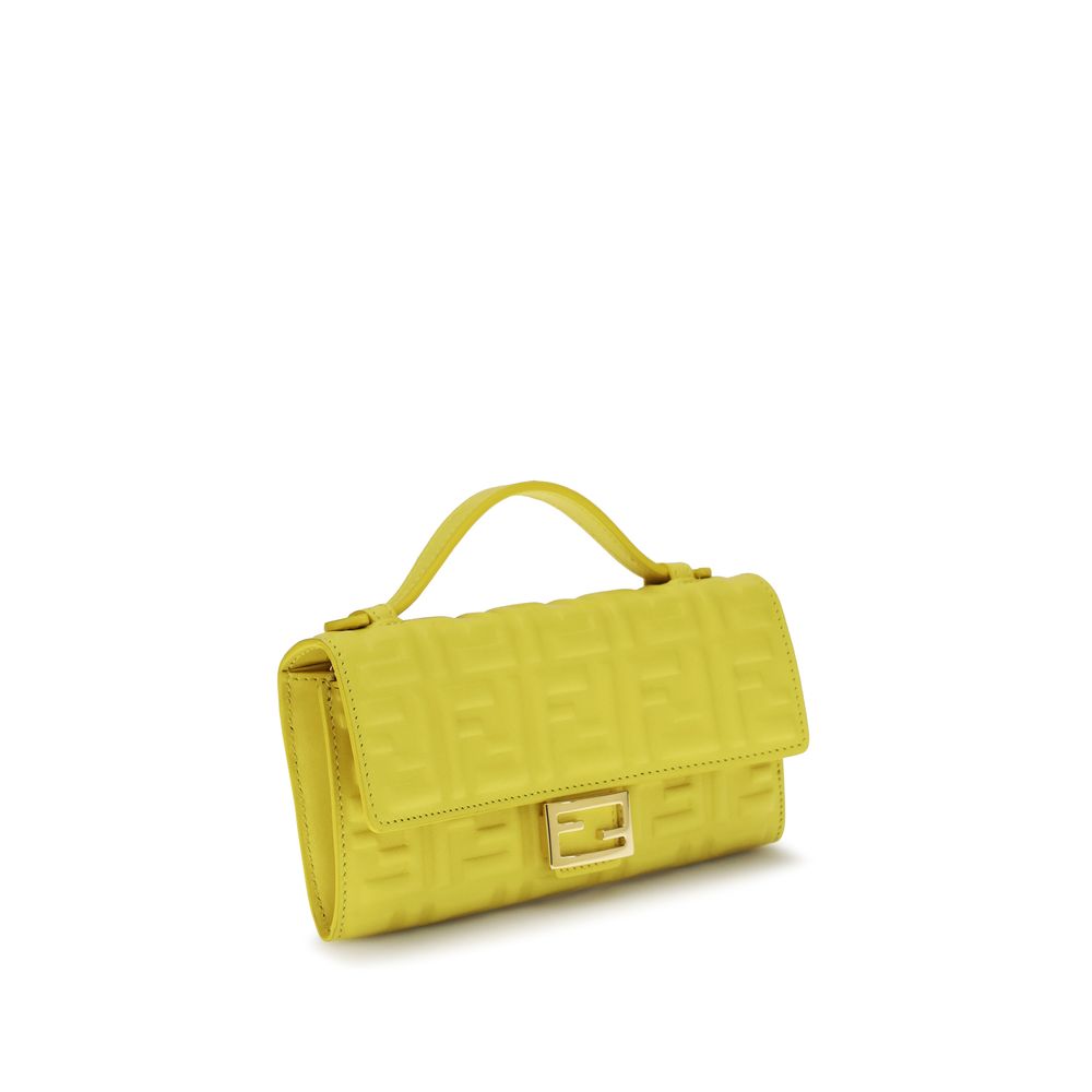 Side view of Fendi Baguette Continental Wallet in Broom Yellow embossed nappa leather with gold FF clasp, available at The Exclusive Line, Singapore.