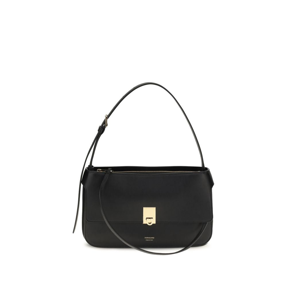 Ferragamo Cara bag extra small in smooth black calfskin with front gold Hug buckle.