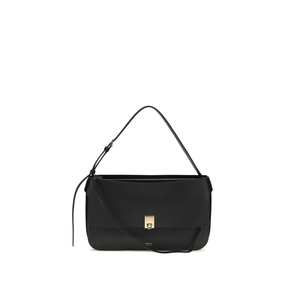 Ferragamo Small Cara bag in black calfskin leather featuring a gold-tone Hug buckle.