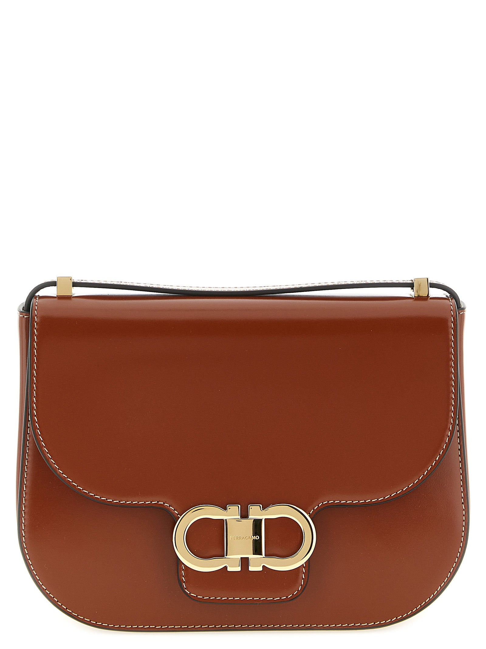 Ferragamo Double Gancini North-South crossbody bag in dark cognac hammered calfskin with gold hardware.